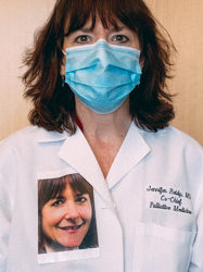 Jennifer Reidy wearing a PPE Mask and PPE Portrait